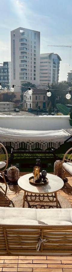 a patio with chairs and a couch on a roof at Heart Of Nicosia - The Gem in Nicosia