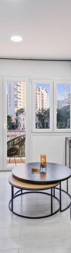 a living room with a couch and a table at Heart Of Nicosia - The Gem in Nicosia