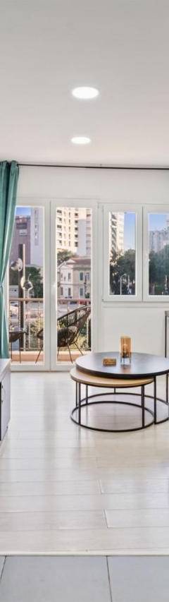 a kitchen and a living room with a couch at Heart Of Nicosia - The Gem in Nicosia