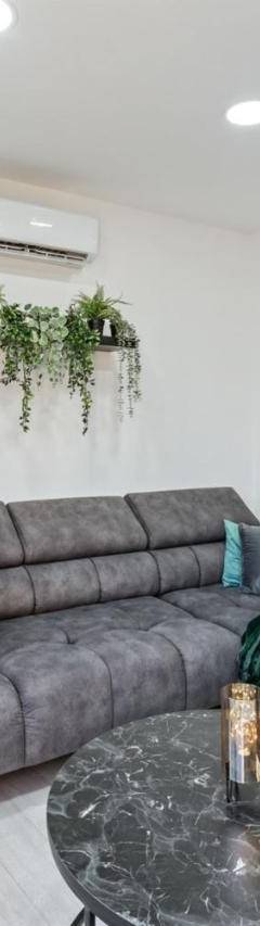 a living room with a couch and a table at Heart Of Nicosia - The Gem in Nicosia