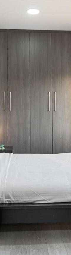 a bedroom with a bed and a desk and a window at Heart Of Nicosia - The Gem in Nicosia