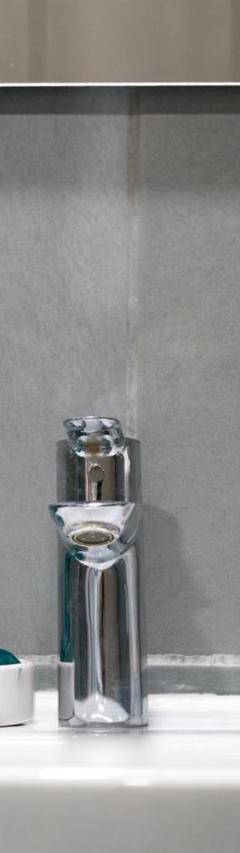 a bathroom sink with a toothbrush and a faucet at Heart Of Nicosia - The Gem in Nicosia