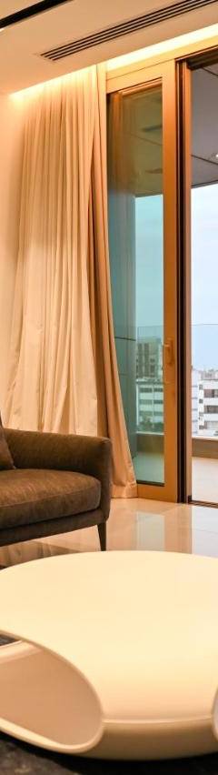 a living room with a couch and a table at The 1 -Nicosia Elite Stay- Gym Pool 24h Concierge in Nicosia