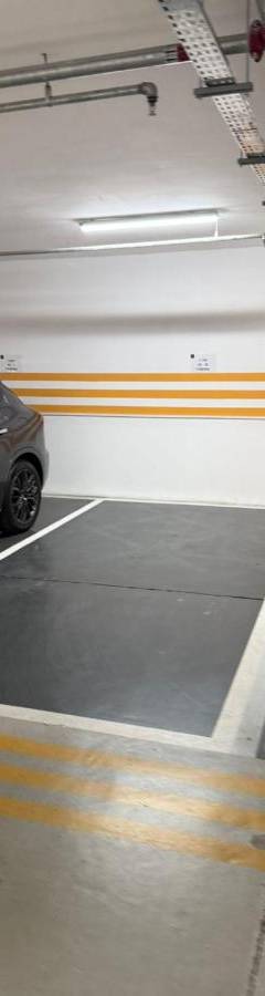 a parking garage with a car parked in it at The 1 -Nicosia Elite Stay- Gym Pool 24h Concierge in Nicosia