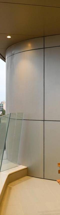 a balcony with a table and a tv on a building at The 1 -Nicosia Elite Stay- Gym Pool 24h Concierge in Nicosia