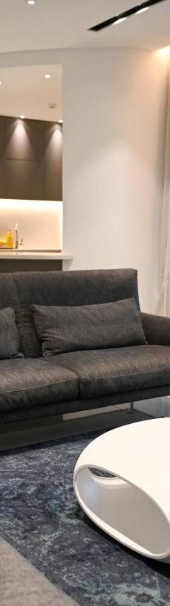 a living room with a couch and a table at The 1 -Nicosia Elite Stay- Gym Pool 24h Concierge in Nicosia