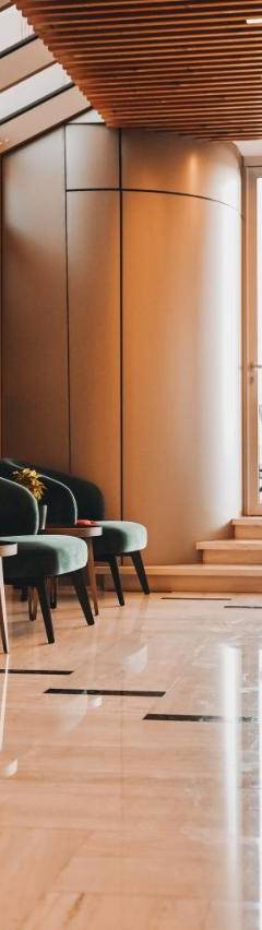 a waiting room with chairs and tables and windows at The 1 -Nicosia Elite Stay- Gym Pool 24h Concierge in Nicosia
