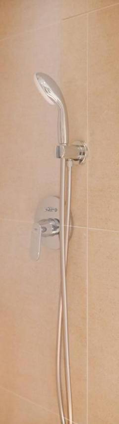 a shower with a glass door in a bathroom at The 1 -Nicosia Elite Stay- Gym Pool 24h Concierge in Nicosia