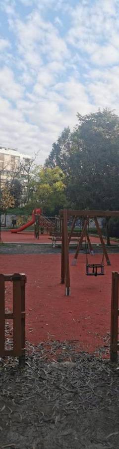 an empty playground with benches and a pole at Theo 202 - Cozy 2 Bdr Nicosia Free Parking &amp; Wi-Fi in Nicosia