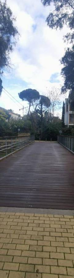 a bridge in a park with trees and a fence at Theo 202 - Cozy 2 Bdr Nicosia Free Parking &amp; Wi-Fi in Nicosia