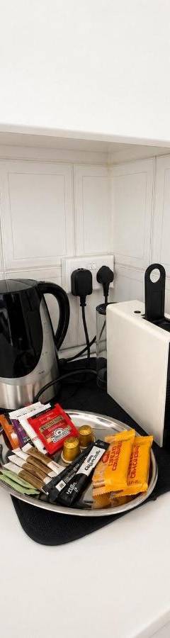a kitchen counter with a tray of food and a coffee maker at Theo 302 - Comfort 2 Queen Bdr Nicosia with Parking in Nicosia