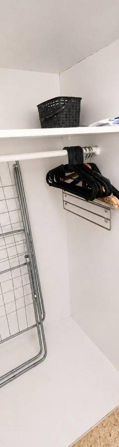 a closet with a shelf and a glass door at Theo 302 - Comfort 2 Queen Bdr Nicosia with Parking in Nicosia
