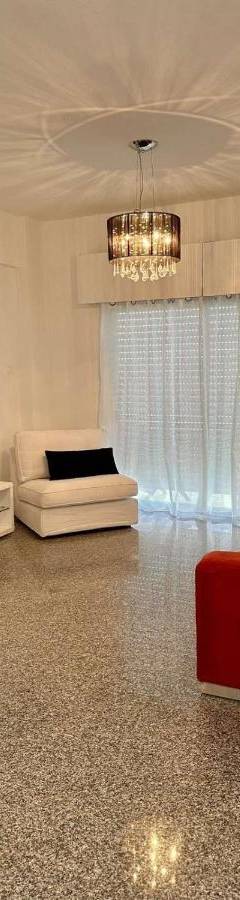 a living room with a couch and a flat screen tv at Theo 403 - Charming 2 Bdr Nicosia, Parking &amp; Wi-Fi in Nicosia