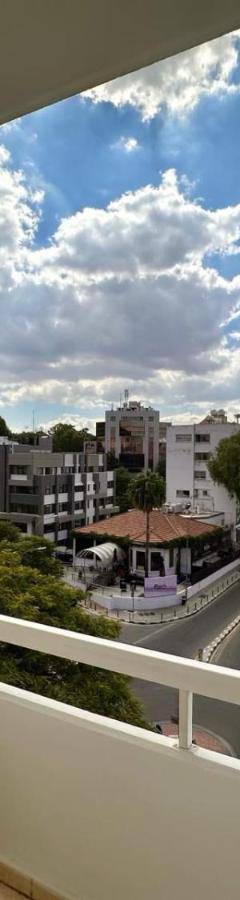 a balcony with a view of a city at Theo 403 - Charming 2 Bdr Nicosia, Parking &amp; Wi-Fi in Nicosia