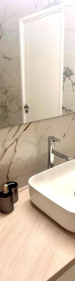a bathroom with a white sink and a mirror at Theo 403 - Charming 2 Bdr Nicosia, Parking &amp; Wi-Fi in Nicosia
