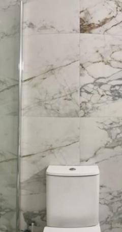 a bathroom with a toilet and a sink and a shower at Theo 403 - Charming 2 Bdr Nicosia, Parking &amp; Wi-Fi in Nicosia