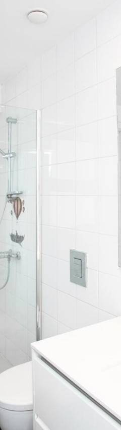 a white bathroom with a shower and a toilet at Mayra Seafront Luxury Apartment (BREAKBOOKING-CY) in Limassol