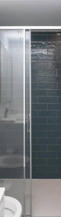 a bathroom with a shower with a toilet and a sink at Mayra Seafront Luxury Apartment (BREAKBOOKING-CY) in Limassol