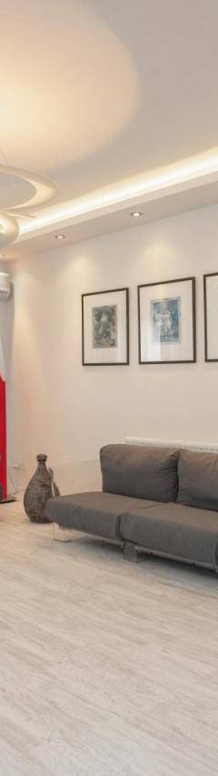 a living room with a couch and two chairs at Mayra Seafront Luxury Apartment (BREAKBOOKING-CY) in Limassol