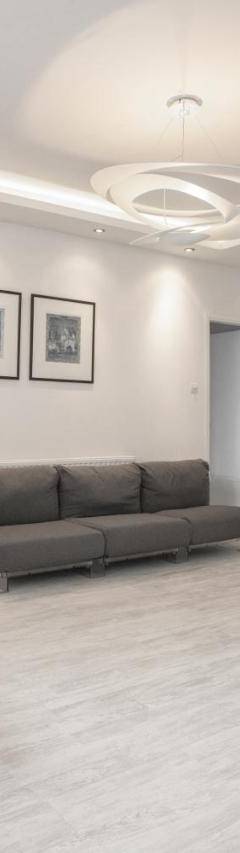 a living room with a couch and a chair at Mayra Seafront Luxury Apartment (BREAKBOOKING-CY) in Limassol