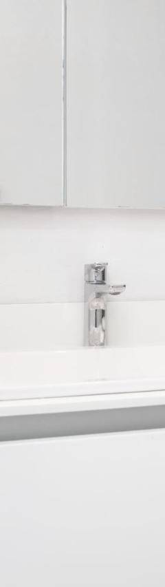 a white bathroom with a sink and a mirror at Mayra Seafront Luxury Apartment (BREAKBOOKING-CY) in Limassol