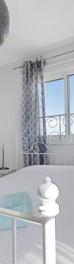 a white crib in a white room with a window at Glabur Stays - The Sunny Atelier - Nicosia City, Free Parking &amp; Wifi, Welcomes You!!! in Nicosia