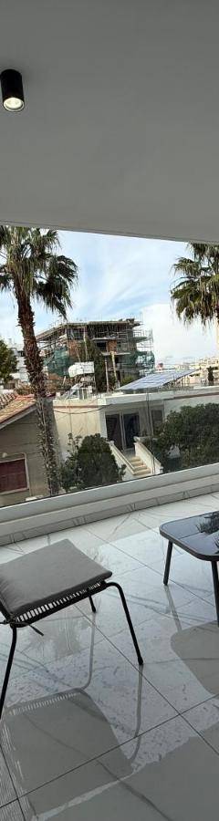 three chairs and a table on a balcony with a view at Glabur Stays - Nicosia's Finest 2 Bedroom in Nicosia