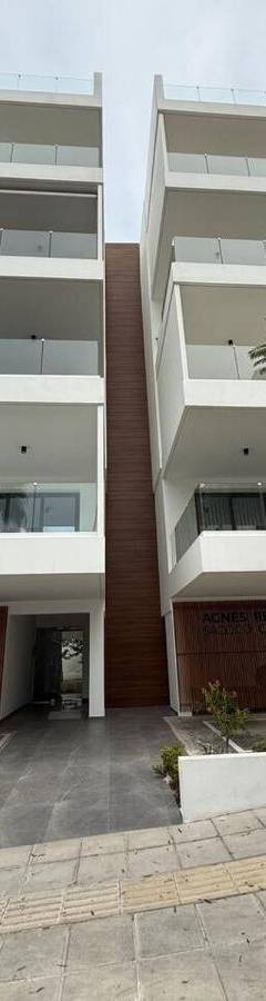 a white car parked in front of a building at Glabur Stays - Nicosia's Finest 2 Bedroom in Nicosia