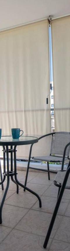 a balcony with a table and chairs on a balcony at Glabur Stays - The Master Atelier - Nicosia City, Free Parking &amp; Wifi, Welcomes You!!! in Nicosia