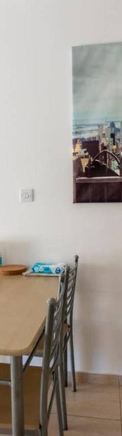 a dining room with a table and chairs at Glabur Stays - The Master Atelier - Nicosia City, Free Parking &amp; Wifi, Welcomes You!!! in Nicosia