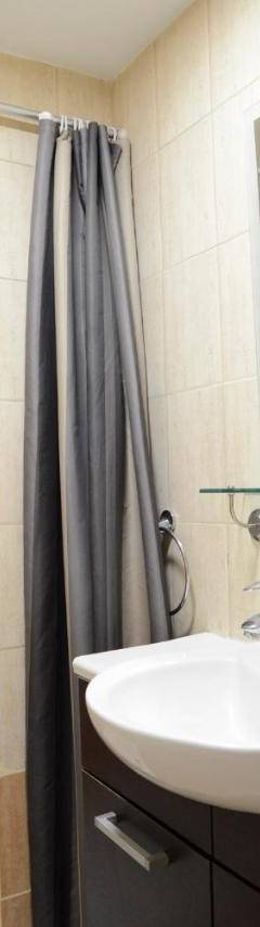 a bathroom with a sink and a shower with a mirror at Glabur Stays - The Cozy Atelier - Nicosia City, Free Parking &amp; Wifi, Welcomes You!!! in Nicosia