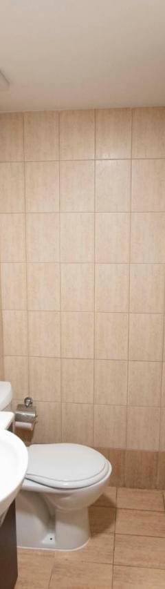 a bathroom with a sink and a toilet and a mirror at Glabur Stays - The Cozy Atelier - Nicosia City, Free Parking &amp; Wifi, Welcomes You!!! in Nicosia