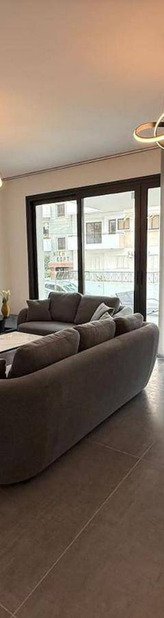 a living room with a couch and a table at Glabur Stays - Nicosia Elite 2BDR in Nicosia