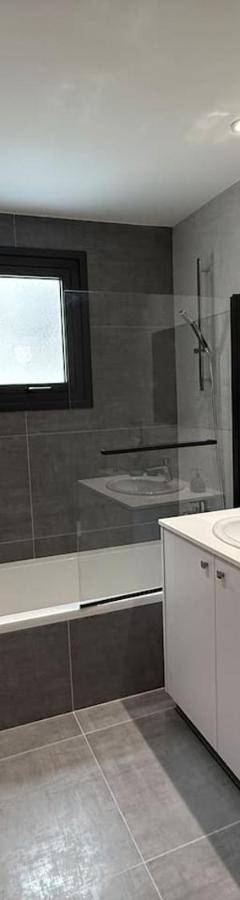a bathroom with a sink and a toilet and a tub at Glabur Stays - Nicosia Elite 2BDR in Nicosia