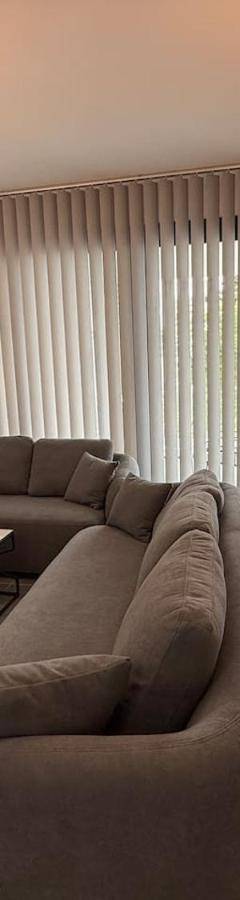a living room with a couch and a table at Glabur Stays - Nicosia Elite 2BDR in Nicosia