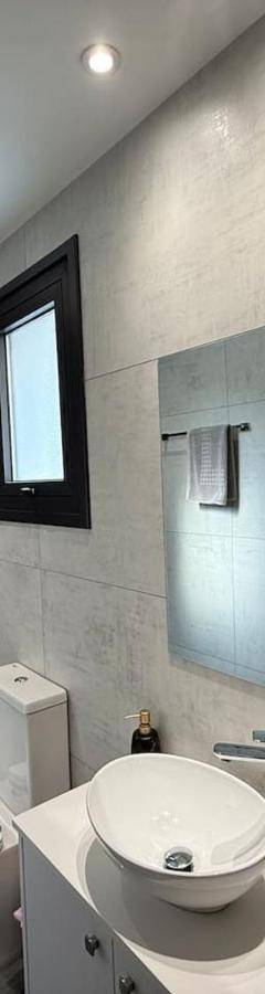 a bathroom with a sink and a toilet and a shower at Glabur Stays - Nicosia Elite 2BDR in Nicosia