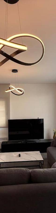 a living room with a couch and a table at Glabur Stays - Nicosia Elite 2BDR in Nicosia
