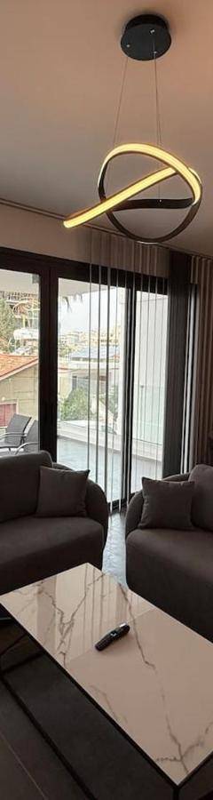 a living room with a couch and a table at Glabur Stays - Nicosia Elite 2BDR in Nicosia