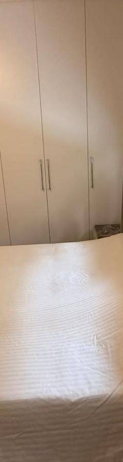 a bed in a room with at Glabur Stays - Nicosia Elite 2BDR in Nicosia