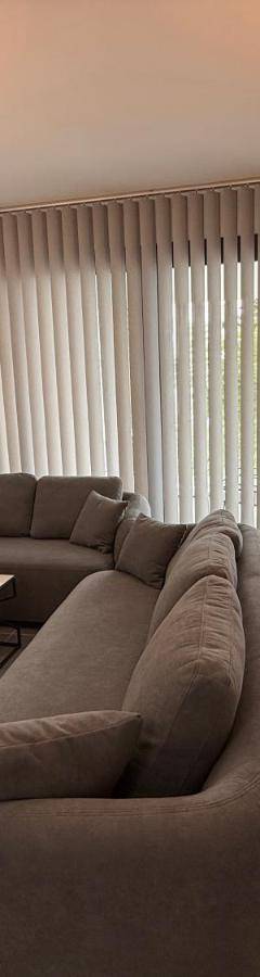 a living room with a couch and a table at Glabur Stays - Nicosia Elite 2BDR in Nicosia