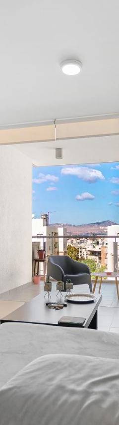 a living room with a couch and a tv at Glabur Stays - The Nicosia Elite - Exceptional Top Floor Apartment Nicosia City, Welcomes U!!! in Nicosia