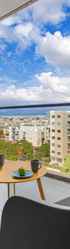 a room with two chairs and a table and a large window at Glabur Stays - The Nicosia Elite - Exceptional Top Floor Apartment Nicosia City, Welcomes U!!! in Nicosia