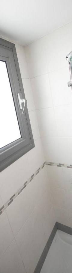 a bathroom with a shower with a window at Glabur Stays - The Nicosia Elite - Exceptional Top Floor Apartment Nicosia City, Welcomes U!!! in Nicosia