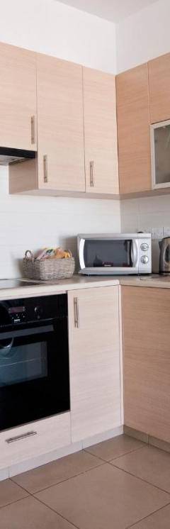 a kitchen with a refrigerator and a dishwasher at Glabur Stays - The Nicosia Elite - Exceptional Top Floor Apartment Nicosia City, Welcomes U!!! in Nicosia