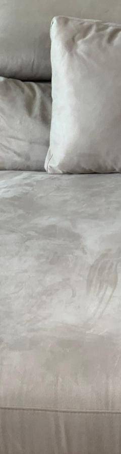 a white couch with two pillows on it at Glabur Stays - The Nicosia Elite - Exceptional Top Floor Apartment Nicosia City, Welcomes U!!! in Nicosia