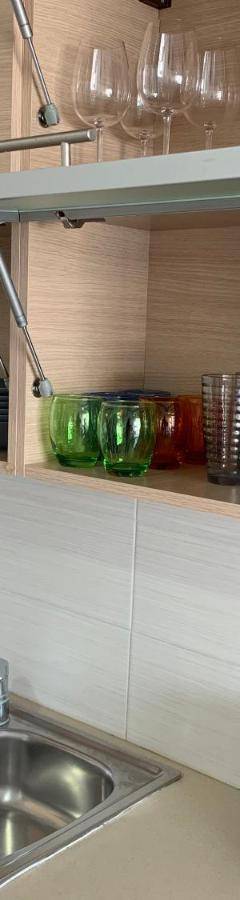 a kitchen counter with a sink and a microwave at Glabur Stays - The Nicosia Elite - Exceptional Top Floor Apartment Nicosia City, Welcomes U!!! in Nicosia