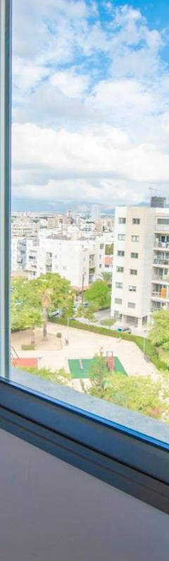 a window with a view of a city at Glabur Stays - The Nicosia Elite - Exceptional Top Floor Apartment Nicosia City, Welcomes U!!! in Nicosia