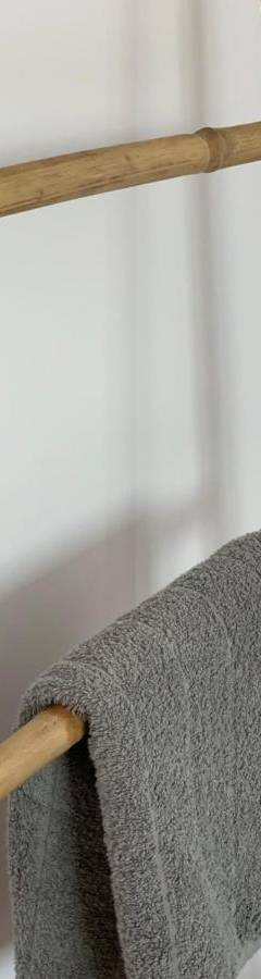 a wooden ladder with a gray towel on it at Glabur Stays - The Nicosia Elite - Exceptional Top Floor Apartment Nicosia City, Welcomes U!!! in Nicosia