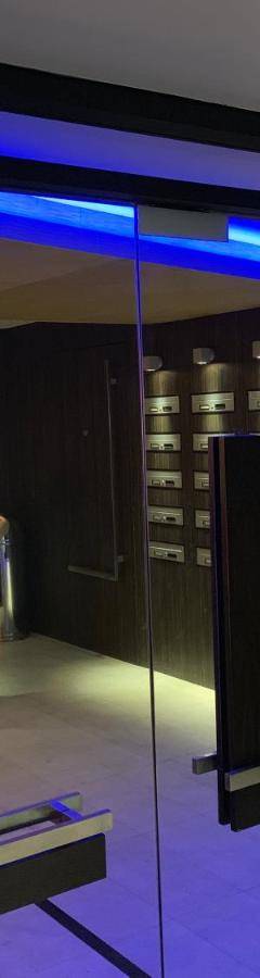 a room with a glass door with a statue in it at Glabur Stays - The Nicosia Elite - Exceptional Top Floor Apartment Nicosia City, Welcomes U!!! in Nicosia