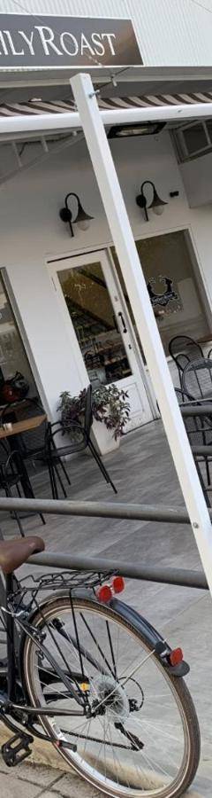 a bike parked in front of a restaurant at Glabur Stays - The Nicosia Elite - Exceptional Top Floor Apartment Nicosia City, Welcomes U!!! in Nicosia